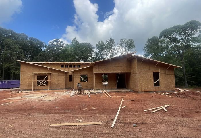 House under construction on a Millwood Land Company lot surrounded by North Georgia forest